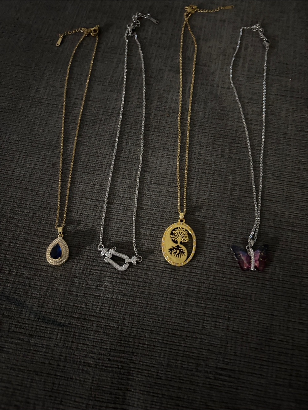 4 gold and silver pendants